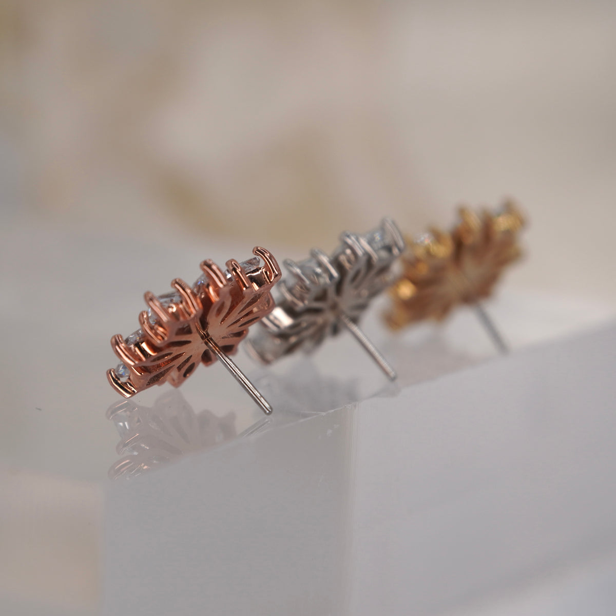 Back view of Buddha Jewelry’s “Hauteness,” showing the rear of the layered crystal settings and attachment detail.