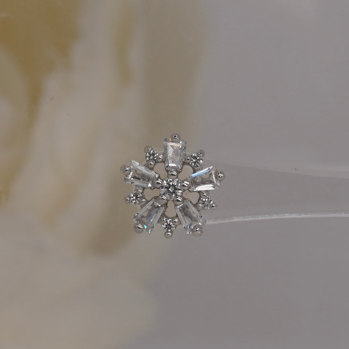 Front view of Buddha Jewelry’s “Audacious” in 14k white gold, featuring a floral cluster of marquise and round crystals.