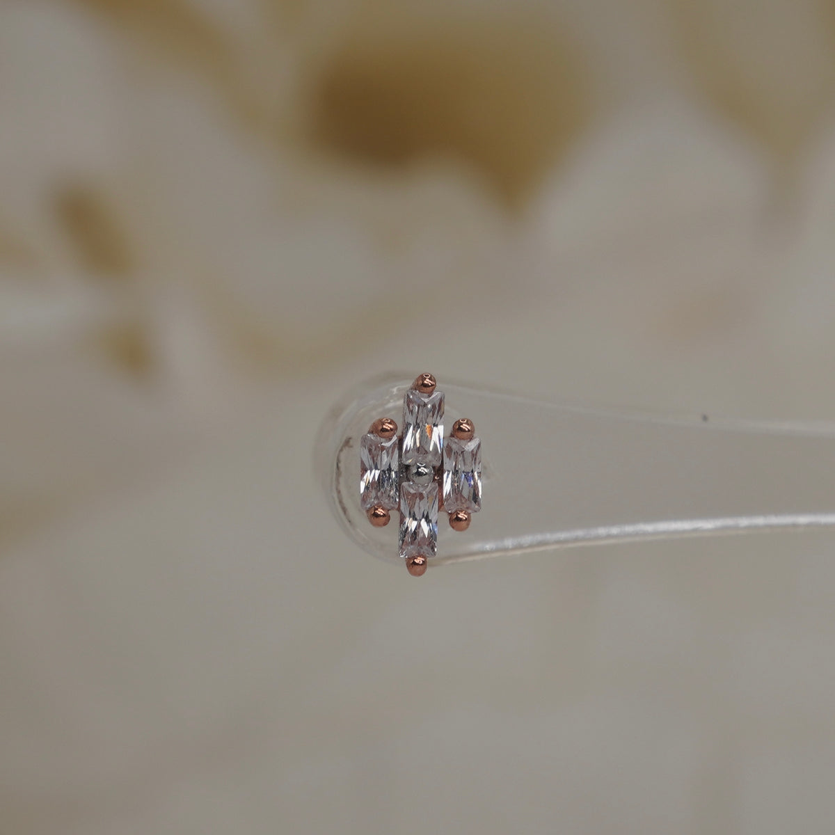 Front view of Buddha Jewelry’s “Fate” in 14k rose gold, featuring a balanced cluster of baguette-style crystals.