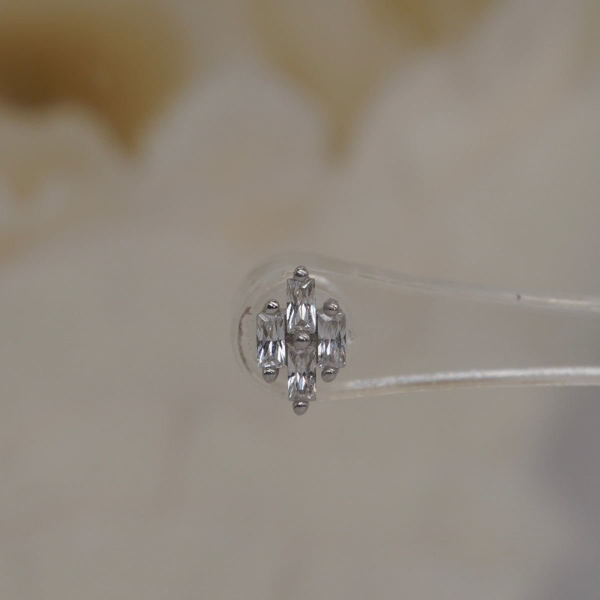 Front view of Buddha Jewelry’s “Fate” in 14k white gold, featuring a balanced cluster of baguette-style crystals.