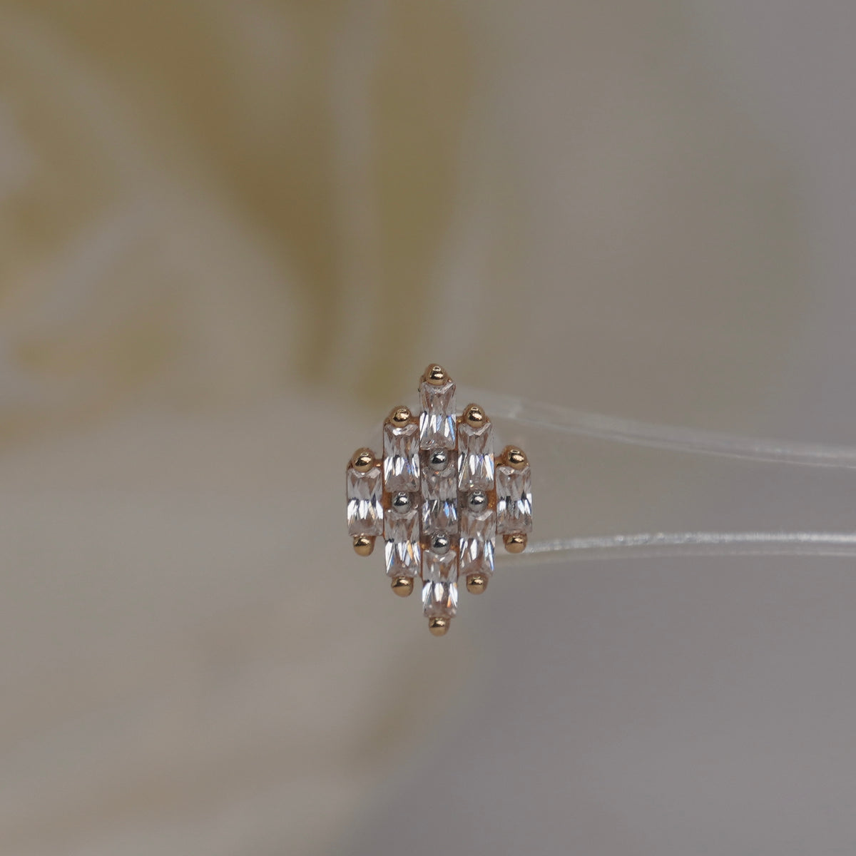 Front view of Buddha Jewelry’s “Wonder” in 14k yellow gold, featuring elongated crystals in a softly spreading fan.
