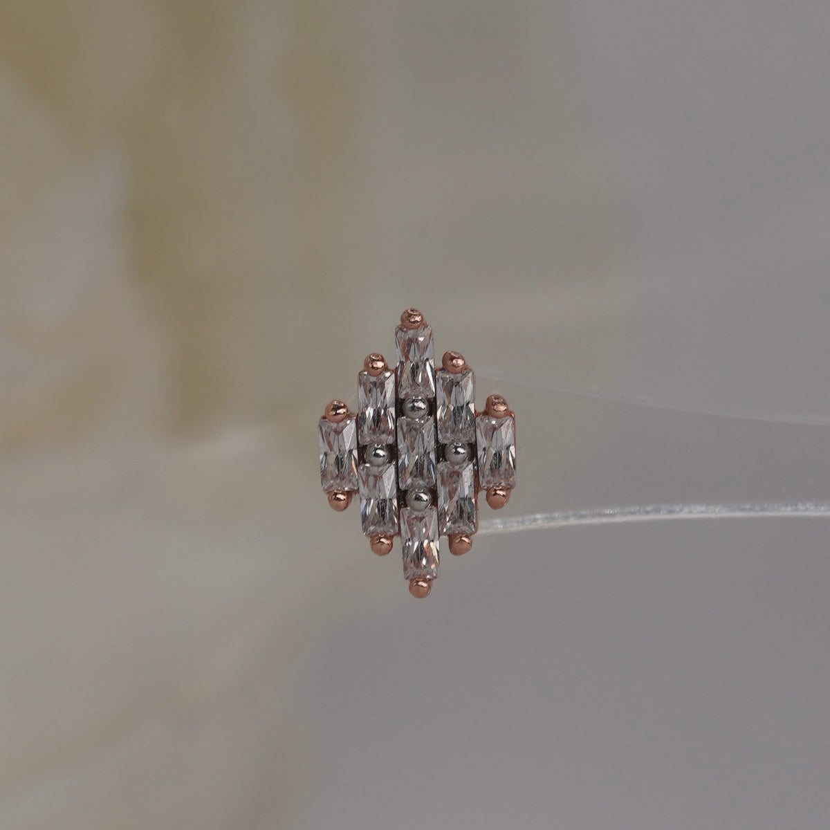 Front view of Buddha Jewelry’s “Wonder” in 14k rose gold, featuring elongated crystals in a softly spreading fan.