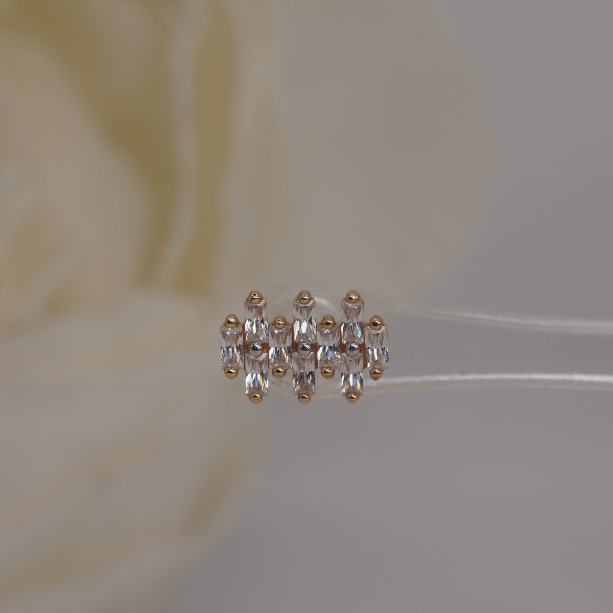 Front view of Buddha Jewelry’s “Imagine” in 14k yellow gold, featuring elongated crystals in a compact, structured arrangement.