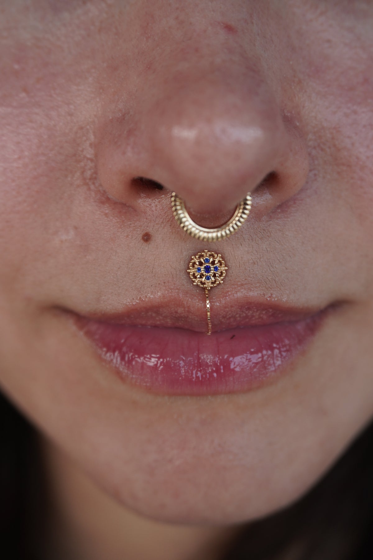 Damask by Buddha Jewelry worn in a philtrum piercing