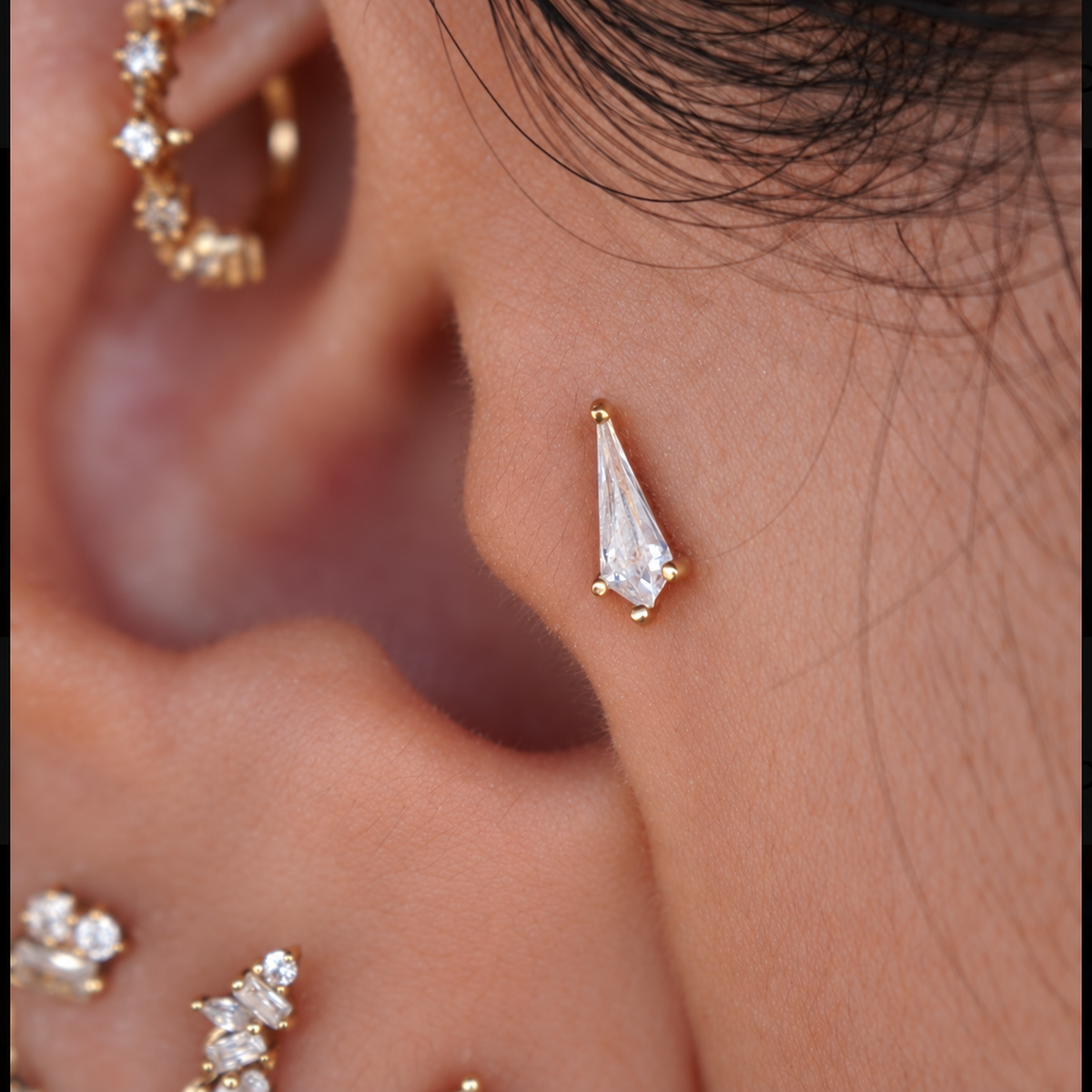 Soho by Buddha Jewelry in 14k yellow gold worn in a piercing