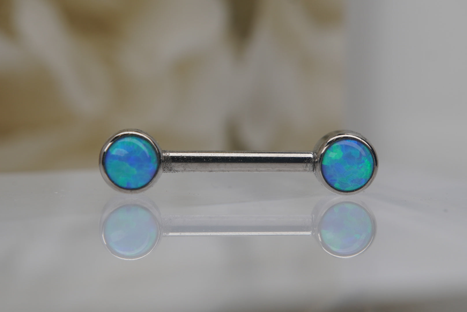 Sky Blue Opal Bezel Nipple Barbell in 14g