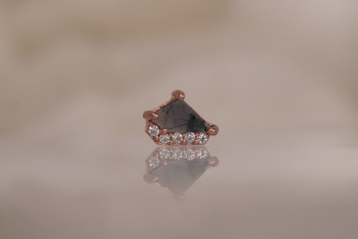 Front view of Buddha Jewelry’s “Elevate” in 14k rose gold, featuring tourmalated quartz with smoky dark inclusions and delicate crystal accents.
