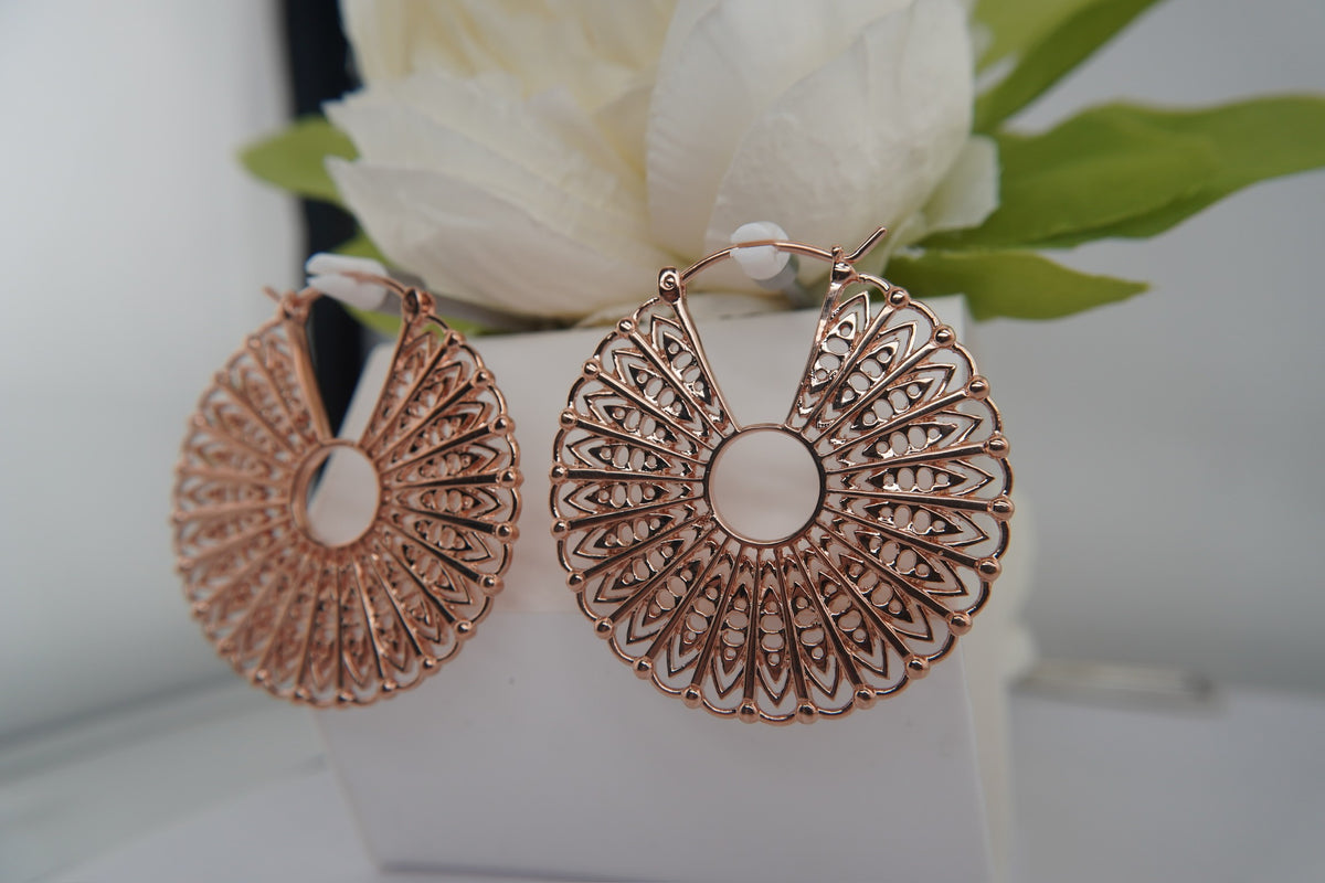 Maya Jewelry 14k"Cloak" hand forged pair of rose gold plated earrings angled view