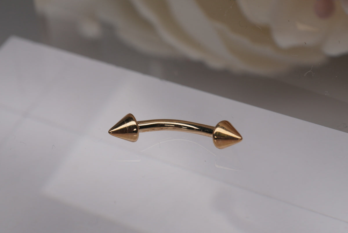 Curved Barbell with Spikes - 14G yellow gold