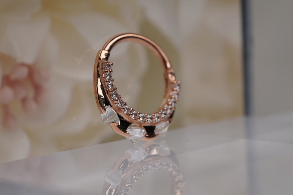 Photo of 14k Rose Gold 16g 3/8" "Gayana" clicker, angled view