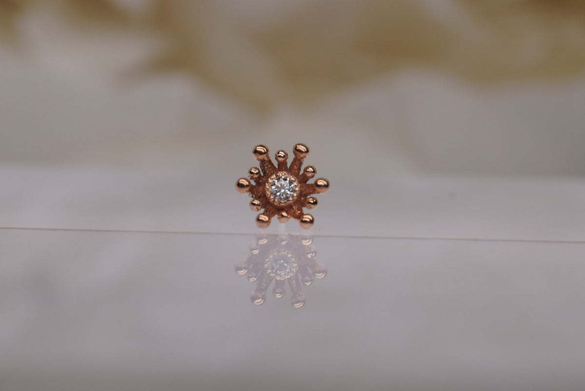 14k gold “Fire Star” threadless end in rose gold, front view