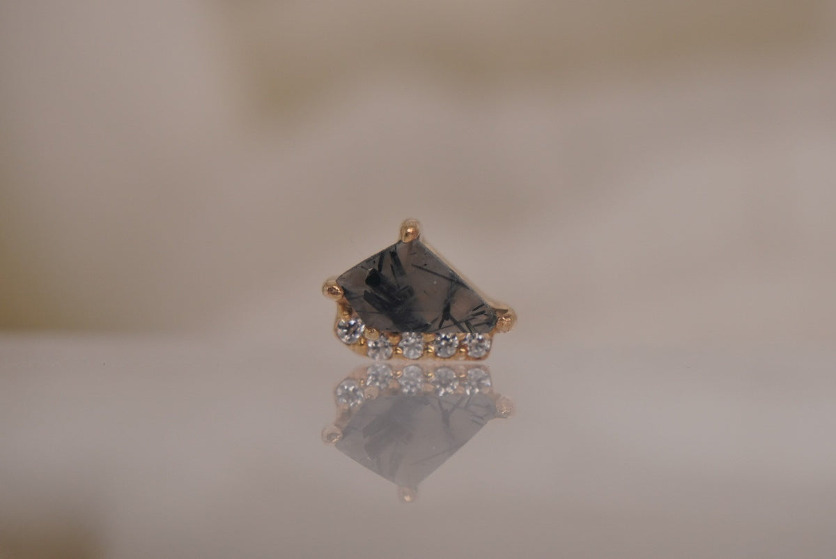 Front view of Buddha Jewelry’s “Elevate” in 14k yellow gold, featuring tourmalated quartz with smoky dark inclusions and delicate crystal accents.