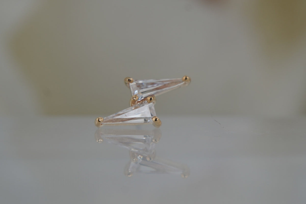 Front view of Buddha Jewelry’s “Electrify” in 14k yellow gold, featuring elongated crystals arranged in a mirrored double-spike design.