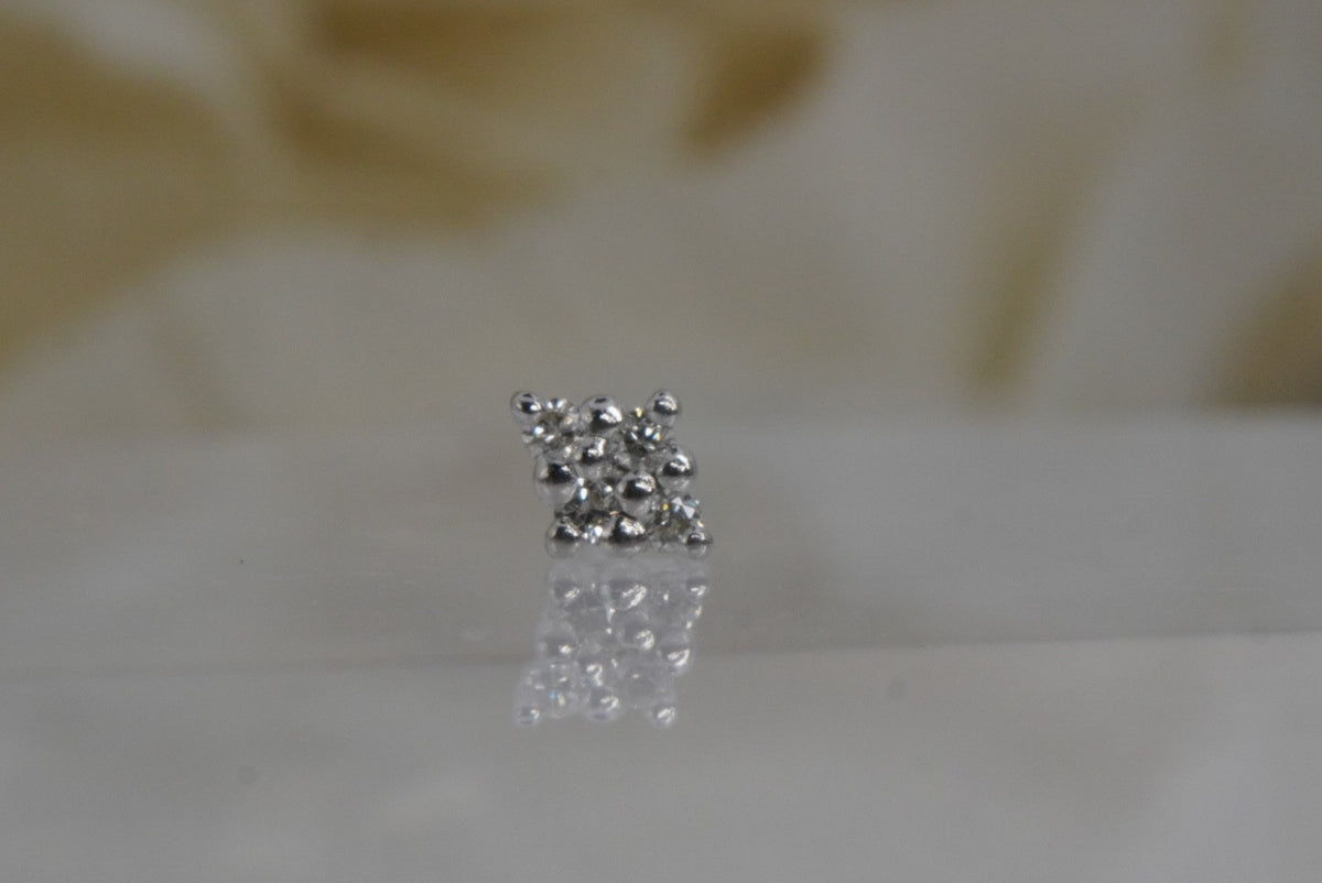 Front view of Buddha Jewelry’s “Belle” in 14k white gold, featuring four round-cut crystals in a diamond-shaped arrangement with white center prongs.