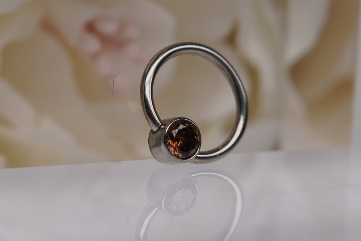Captive Bead with Brown Crystal angled view