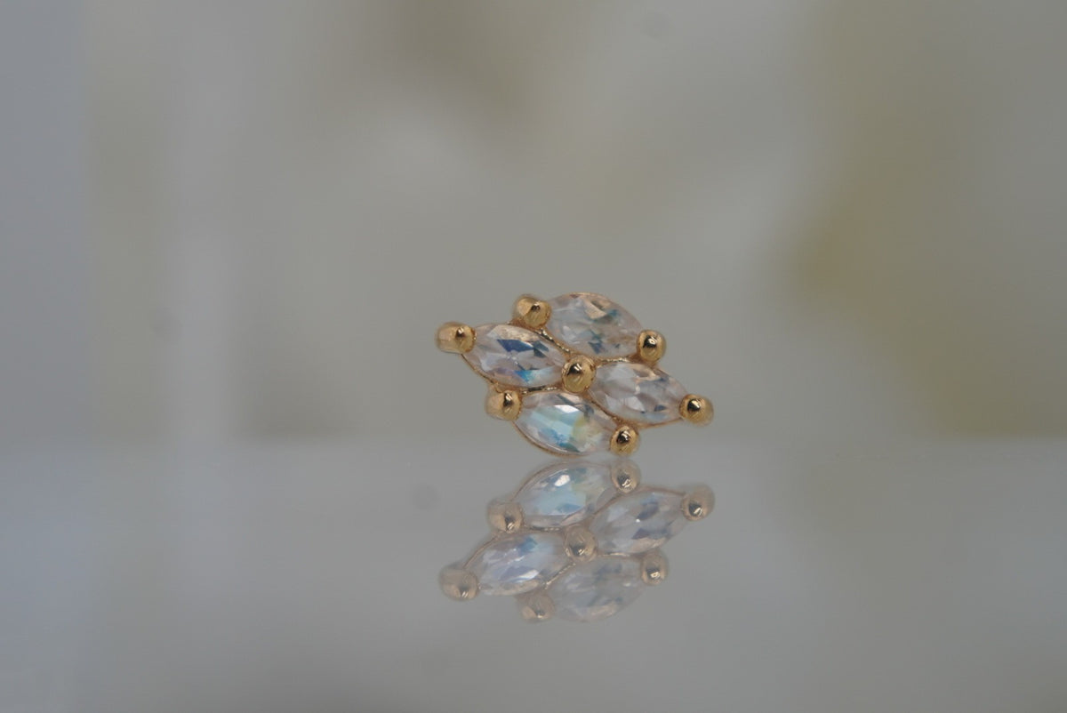 Front view of Buddha Jewelry’s “Dream On” in 14k yellow gold, featuring marquise-shaped rainbow moonstones in a softly elongated cluster.