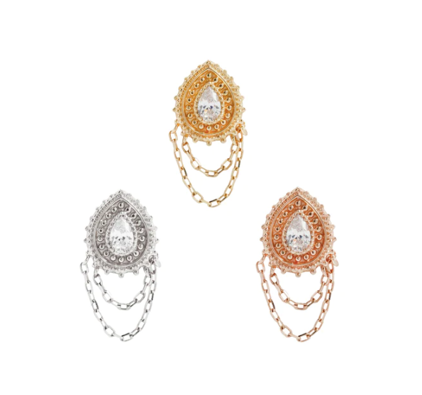 Stock image of Buddha Jewelry’s “Deity” in 14k yellow, white, and rose gold, featuring ornate crystal-centered designs with delicate draped chains.