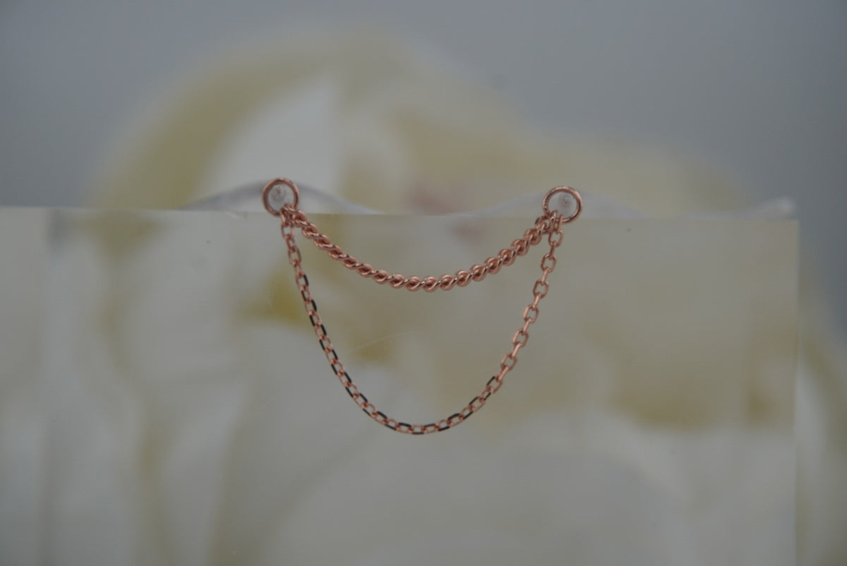 Front view of Buddha Jewelry’s “Diamond Cut + Side Chain” in 14k rose gold, featuring two delicate chains with subtle texture and a layered drape.