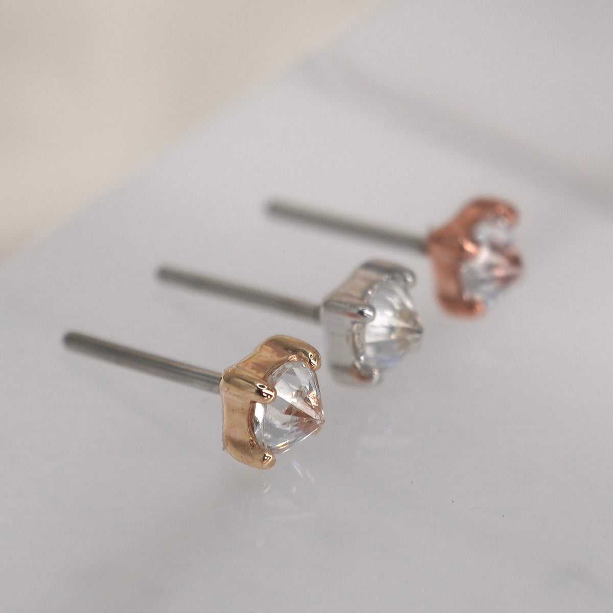 Buddha Jewelry reverse prong gem 14k solid gold white crystal prong threadless  yellow gold white gold rose gold group above view showing reverse gem setting