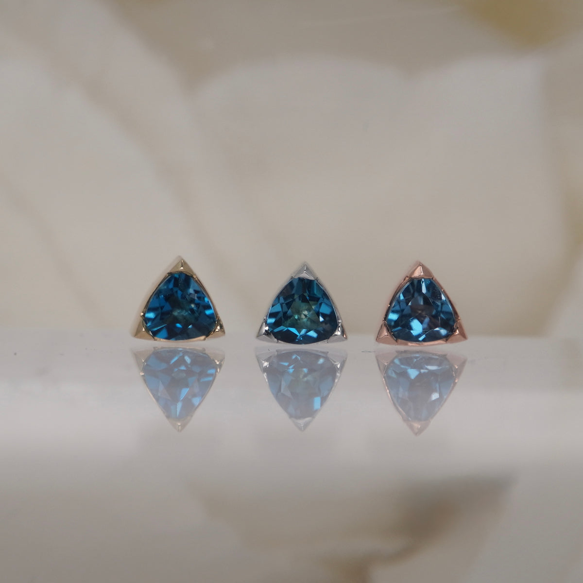 Tether 14k Gold Lennox with London blue topaz trillion threadless yellow gold white gold rose gold group view