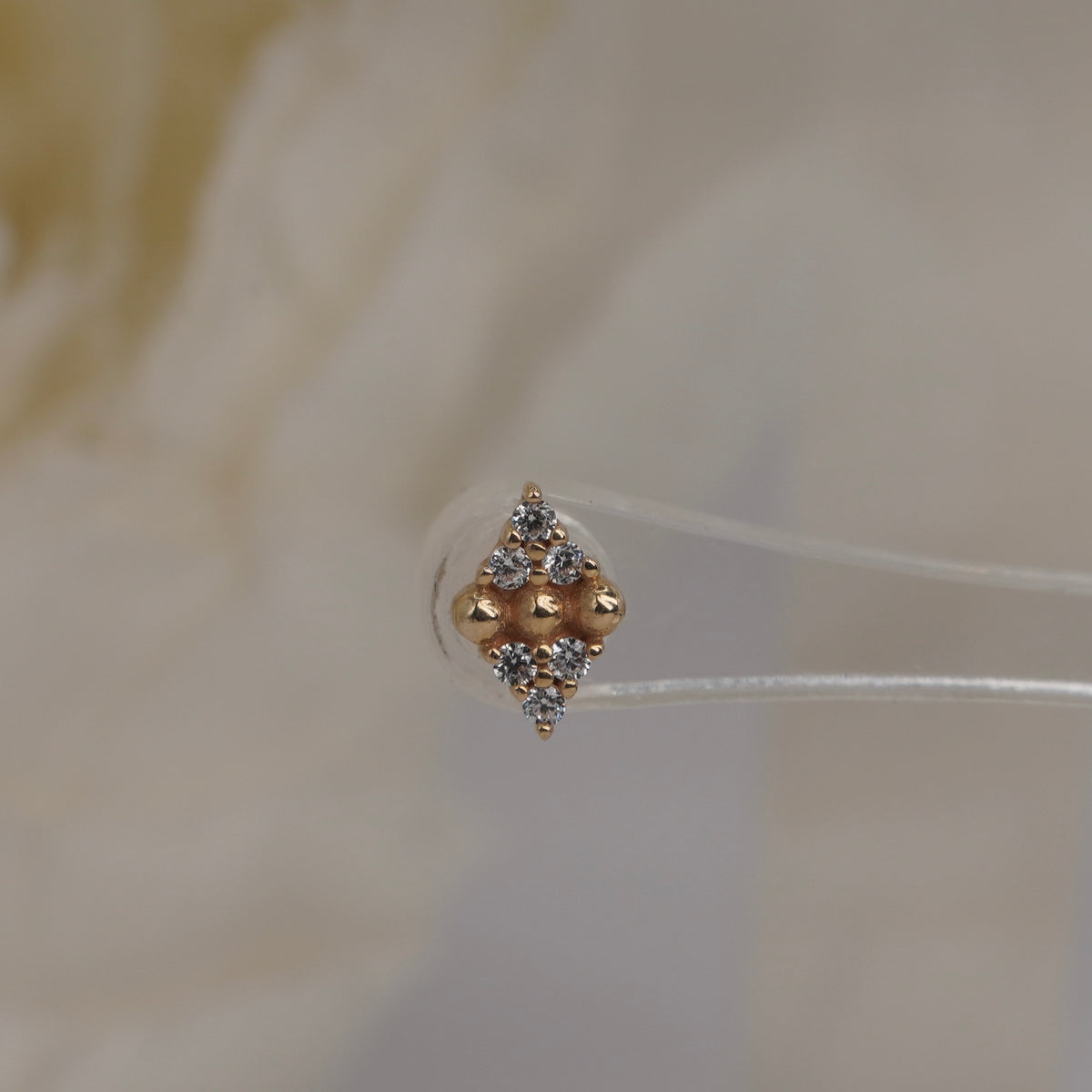 Stock image of Buddha Jewelry’s “Lustre” in 14k yellow gold, showing its balanced stone and polished bead design.
