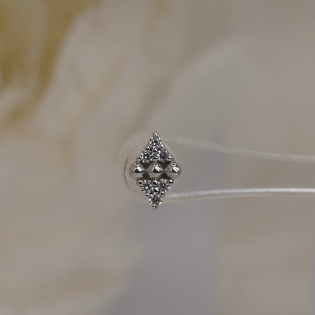 Stock image of Buddha Jewelry’s “Lustre” in 14k white gold, showing its balanced stone and polished bead design.