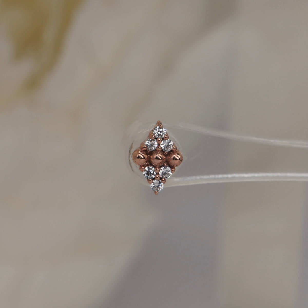 Stock image of Buddha Jewelry’s “Lustre” in 14k rose gold, showing its balanced stone and polished bead design.