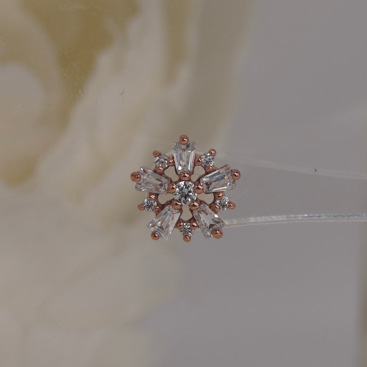 Front view of Buddha Jewelry’s “Audacious” in 14k rose gold, featuring a floral cluster of marquise and round crystals.