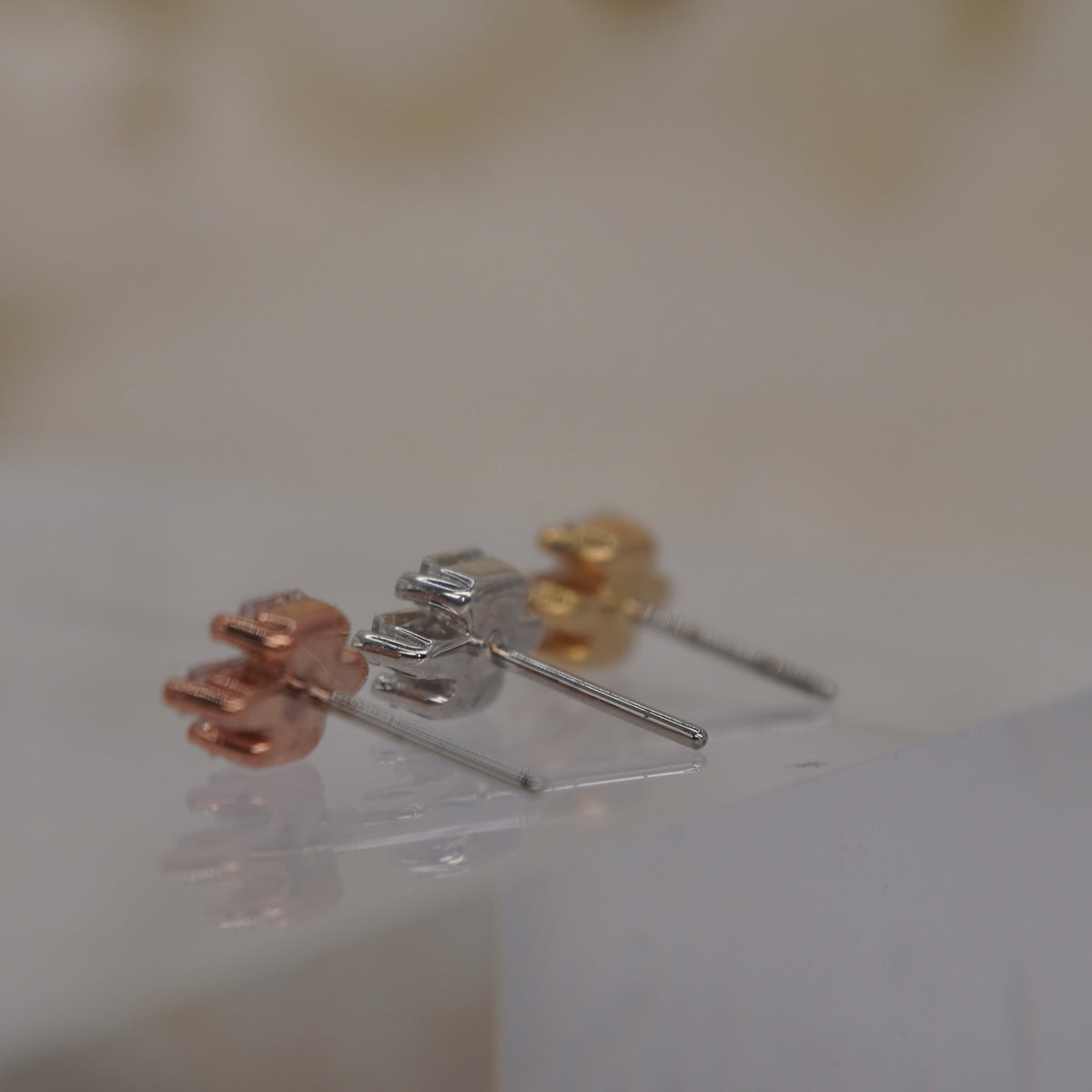 Back view of Buddha Jewelry’s “Fate,” showing the rear of the clustered crystal settings and attachment detail.