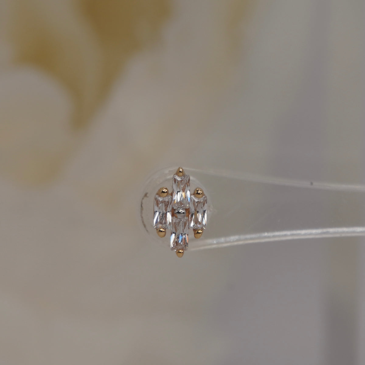 Front view of Buddha Jewelry’s “Fate” in 14k yellow gold, featuring a balanced cluster of baguette-style crystals.