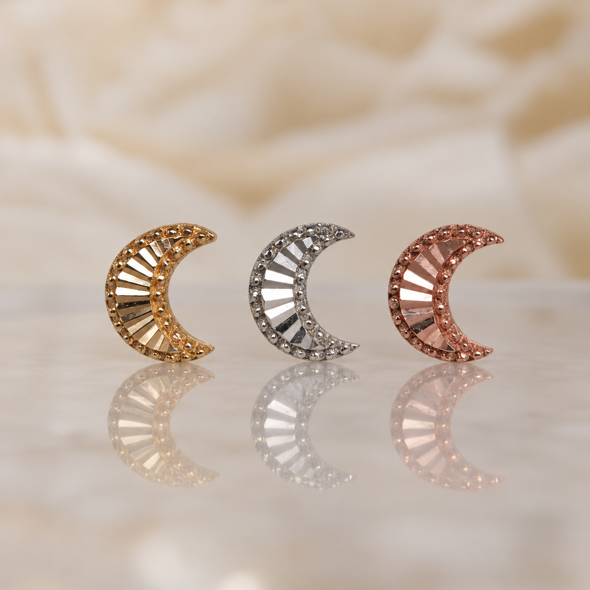 Front view of the After Hours crescent moon in yellow, white, and rose gold.