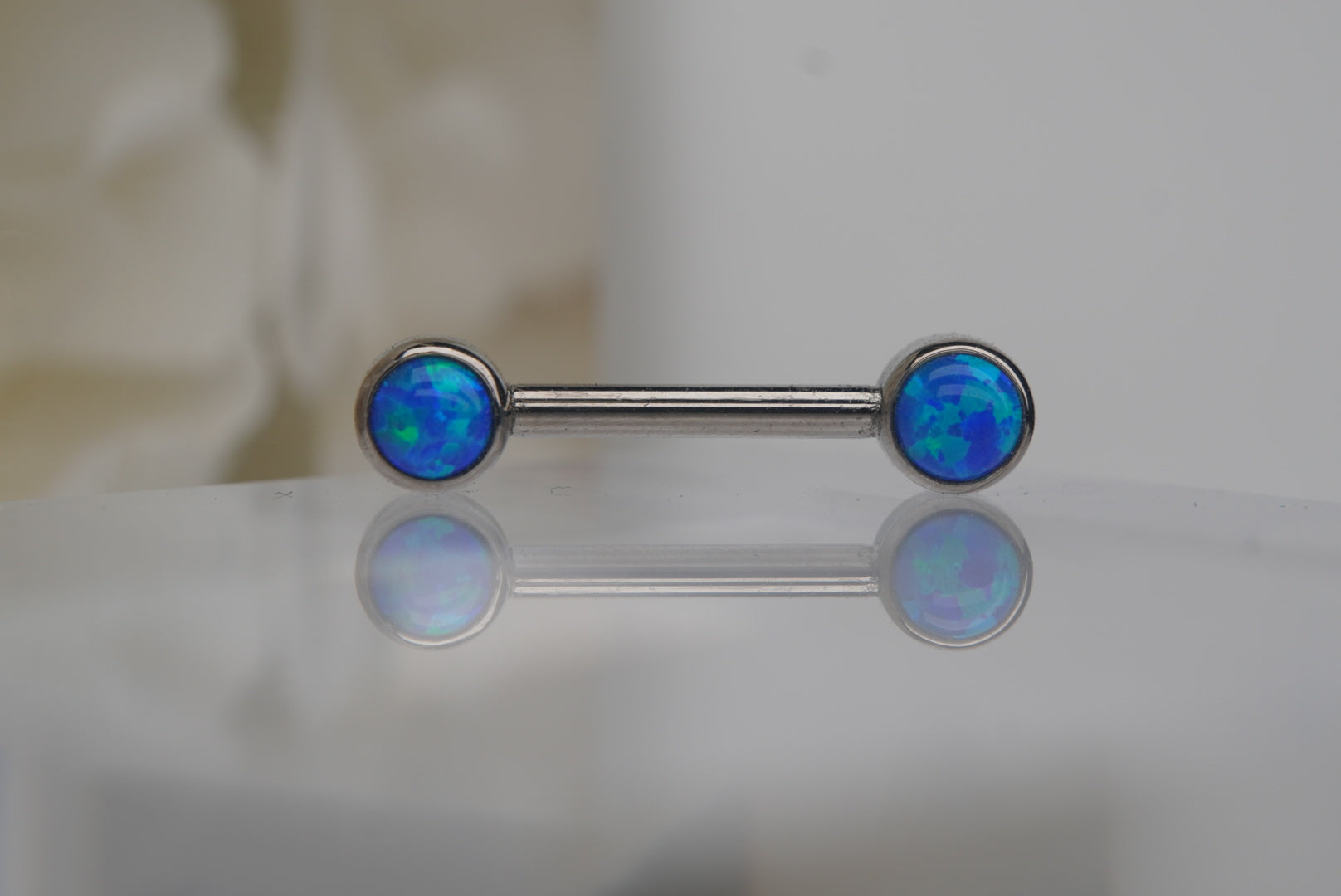 Capri Blue Opal Bezel Nipple Barbell in 14g