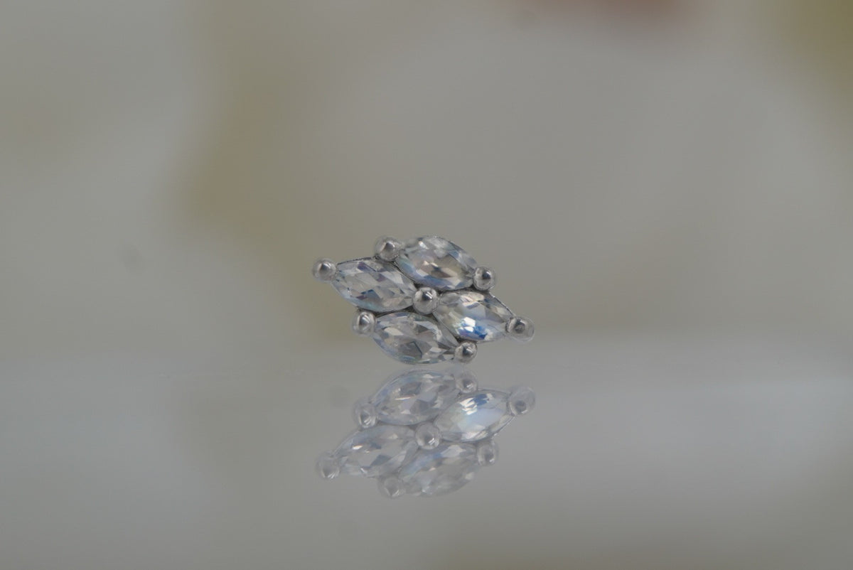Front view of Buddha Jewelry’s “Dream On” in 14k white gold, featuring marquise-shaped rainbow moonstones in a softly elongated cluster.