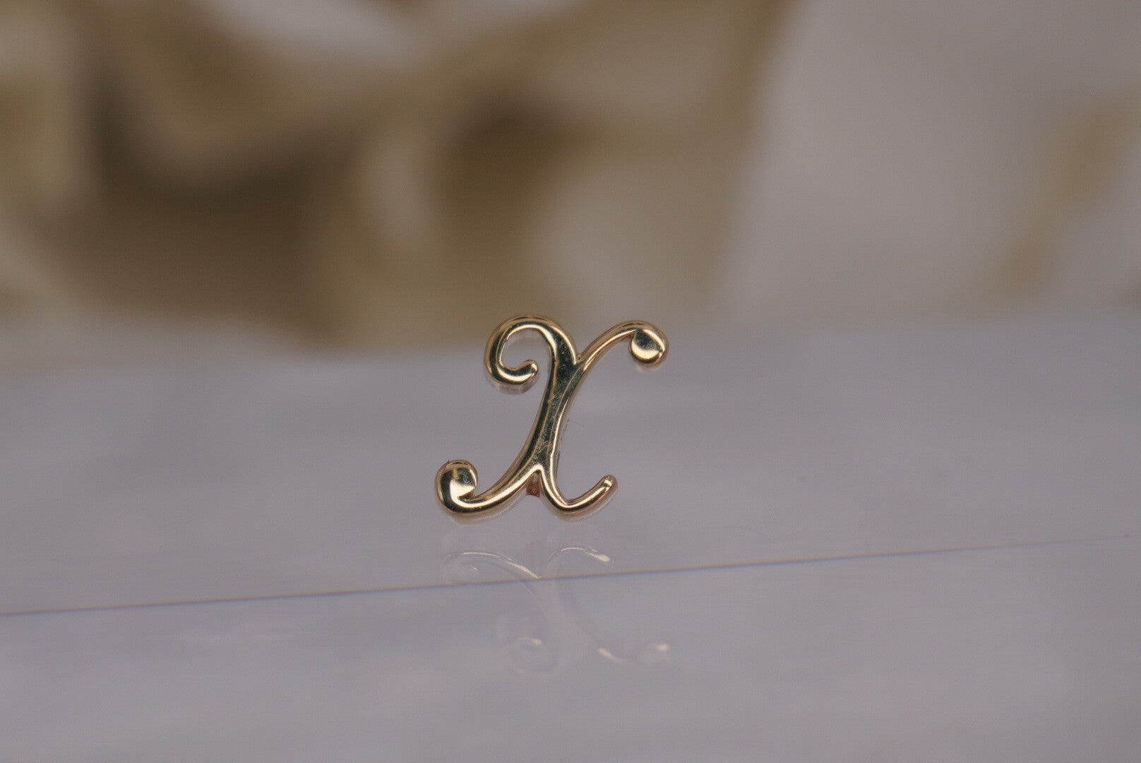 Initial X