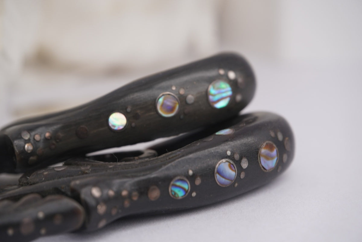 Close up photo of Blackened Wood Hangers with Abalone- 1/2" to show detail