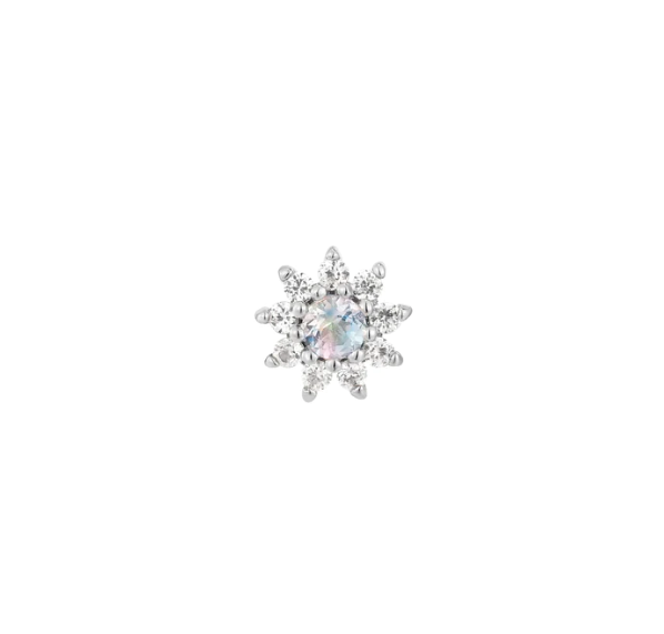 Stock image of Buddha Jewelry’s “Eloise” in 14k white gold, showing its iridescent moonstone center and delicate white sapphire petals.