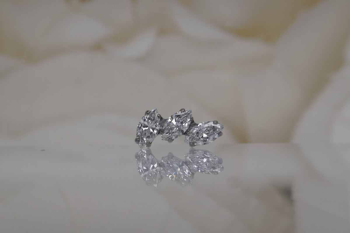 Titanium prong-set "Sprig Marquise Fan" with VS Clarity lab created Diamonds.  Available in Left and Right orientations