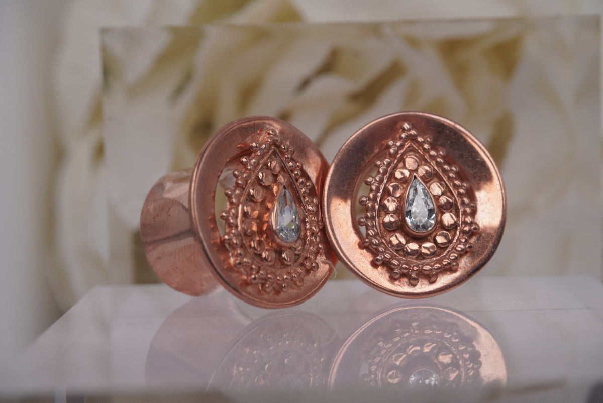 Side view of Buddha Jewelry’s “Deity Plug” in rose gold, showing its plug profile.