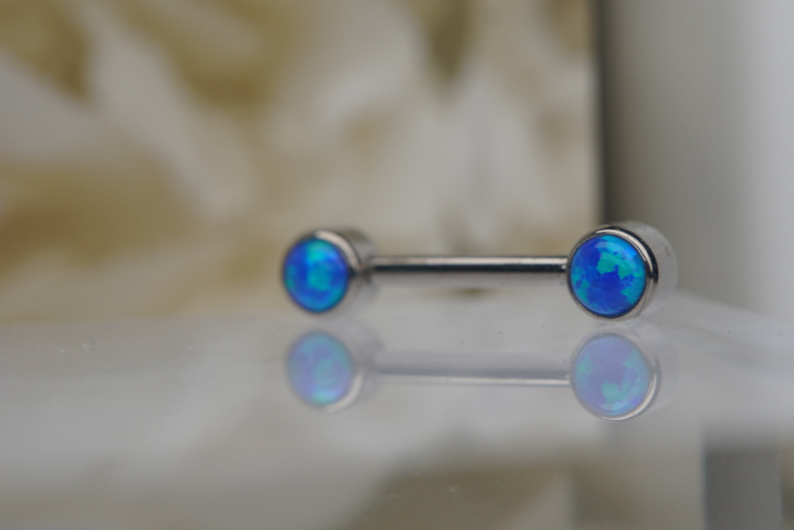 Capri Blue Opal Bezel Nipple Barbell in 14g