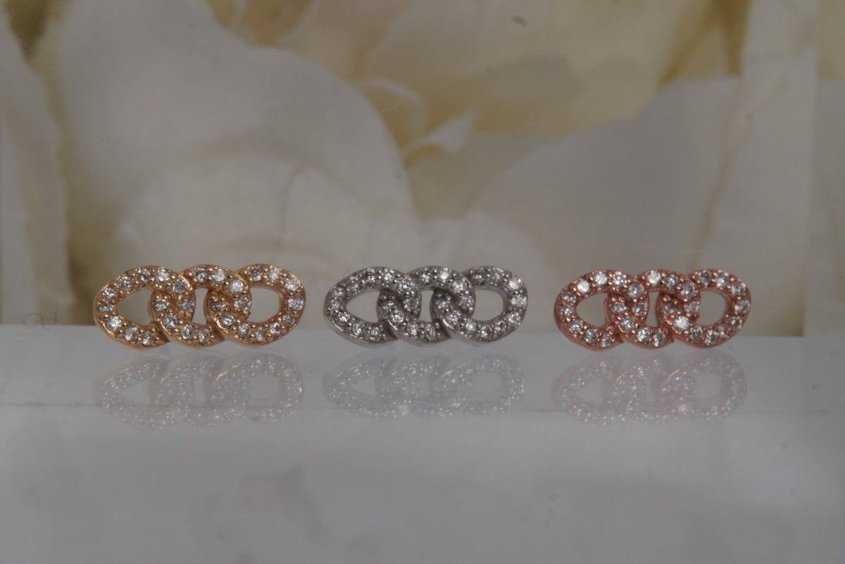 Front view of Buddha Jewelry’s “Chainlink” in 14k yellow, white, and rose gold, featuring interlocking links adorned with pavé-set genuine diamonds.