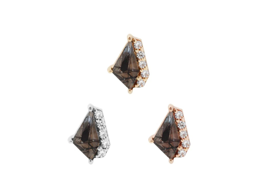 Stock image of Buddha Jewelry’s “Elevate” in 14k yellow, white, and rose gold, featuring tourmalated quartz centerpieces with crystal accents.