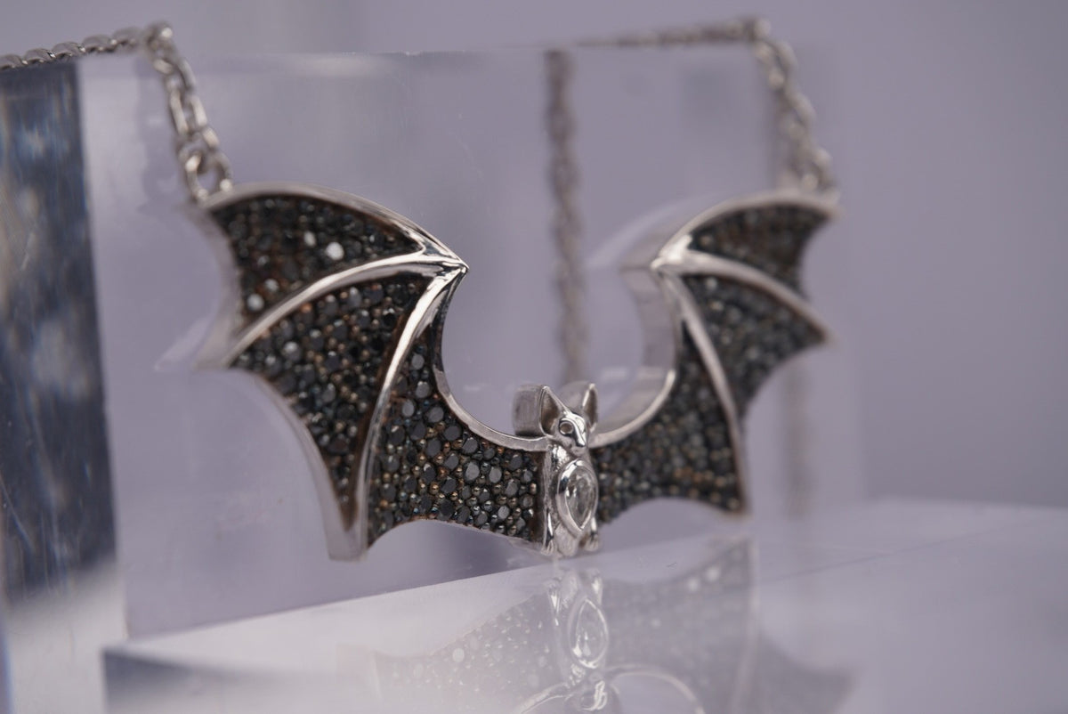 Angled Side view Sid the Bat Necklace with Genuine Black and White Diamonds White Gold To Show Detail