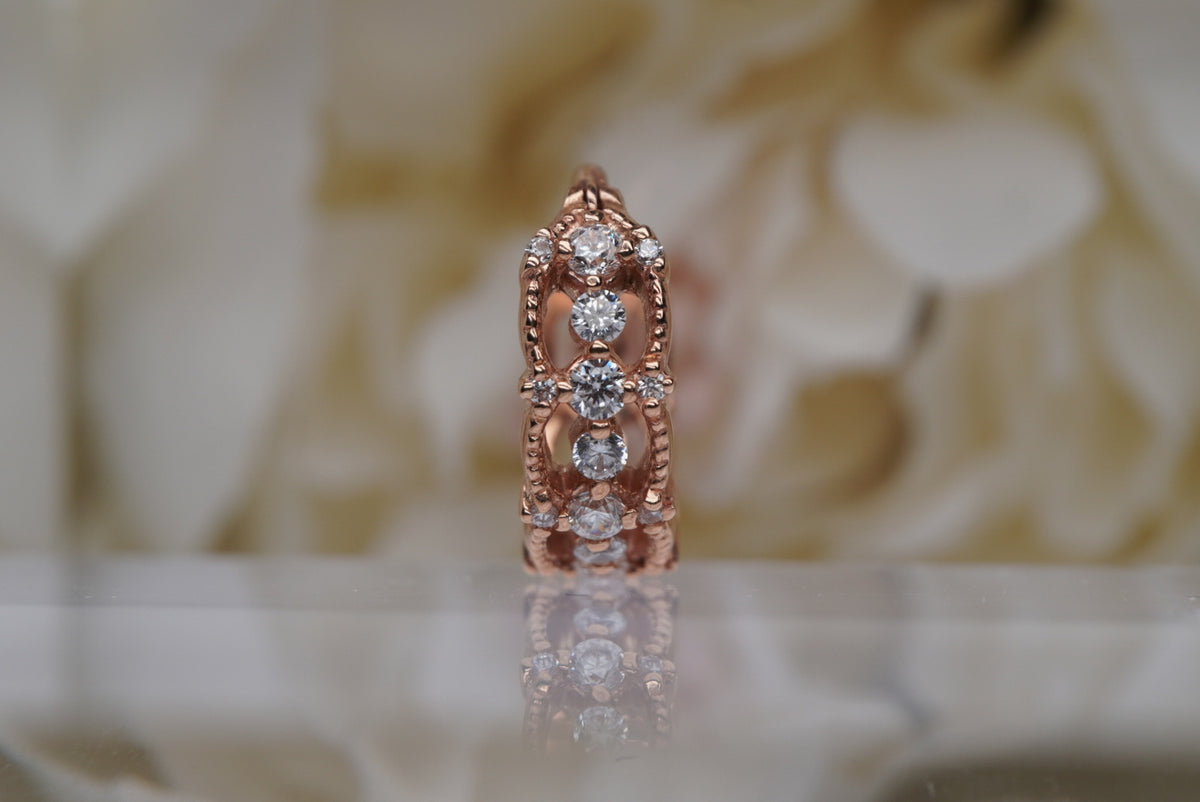 Photo of "Chaaya" Clicker in 16g 3/8" Rose Gold with White Crystals, center view view