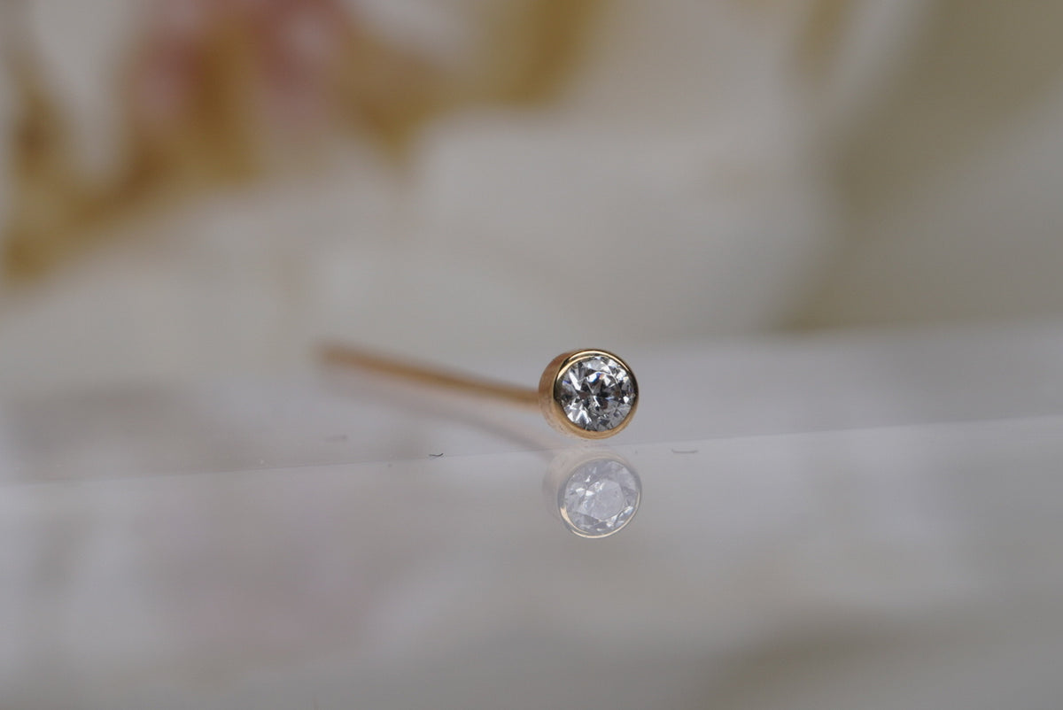 14k Solid Yellow Gold 20g Nostril Screw with a bezel set crystal
