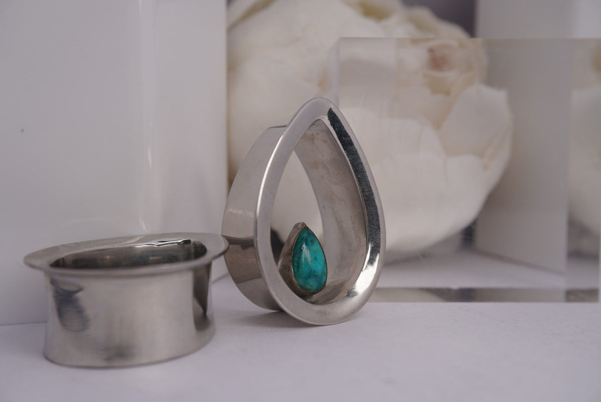 Side view of "Evoke" Eyelet in 1 1/8" 18k white gold plated teardrop Chrysocolla and double flared 