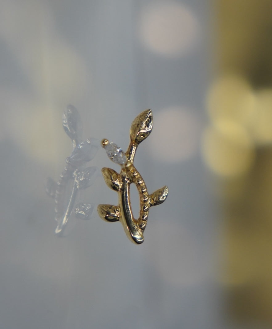 Side view of the branch design, showing the profile of its leaves and marquise-cut crystal.