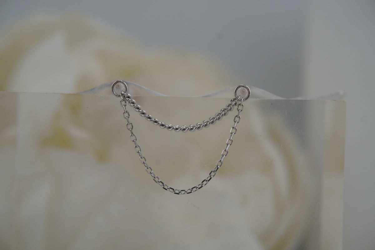 Front view of Buddha Jewelry’s “Diamond Cut + Side Chain” in 14k white gold, featuring two delicate chains with subtle texture and a layered drape.