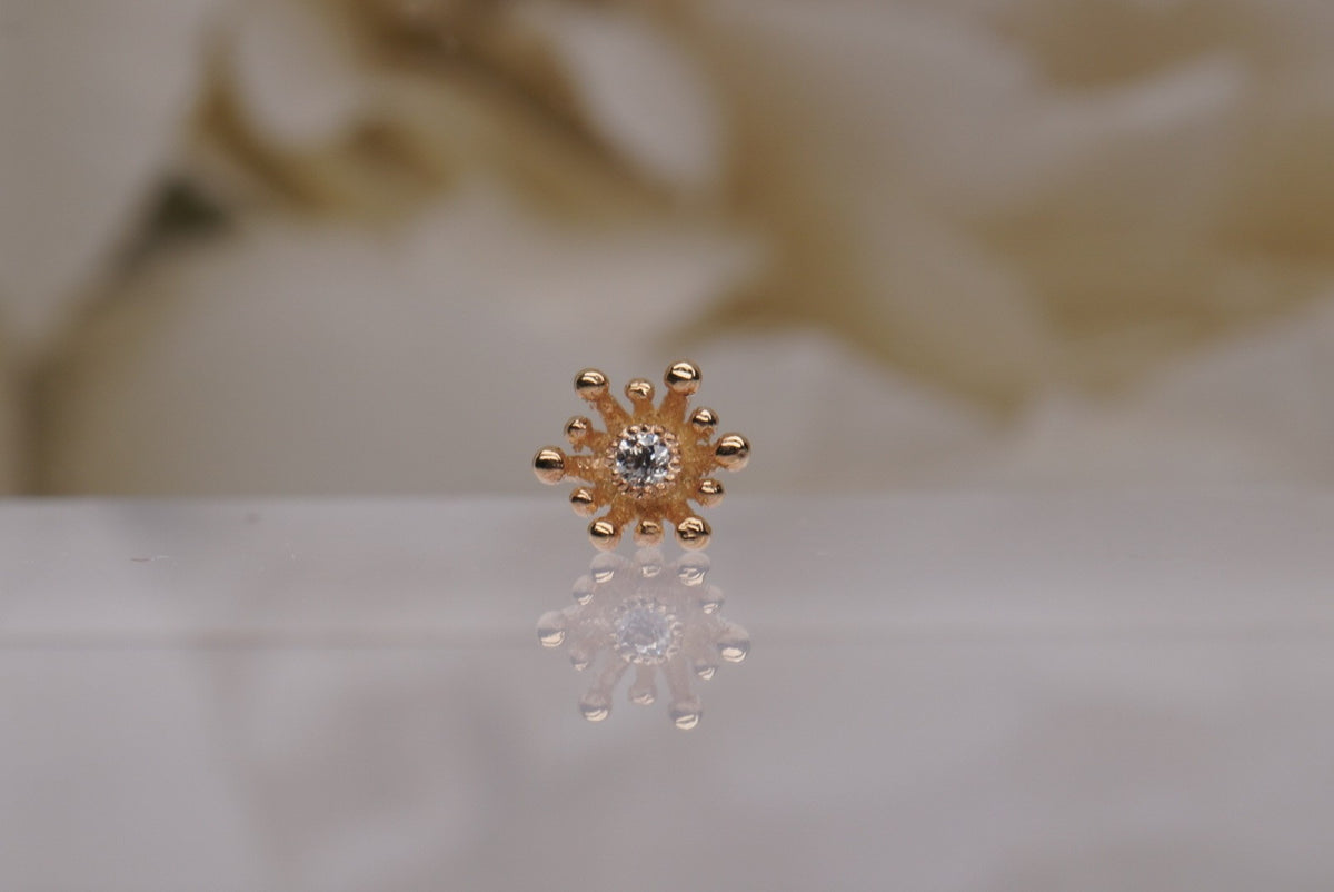 14k gold “Fire Star” threadless end in yellow gold, front view