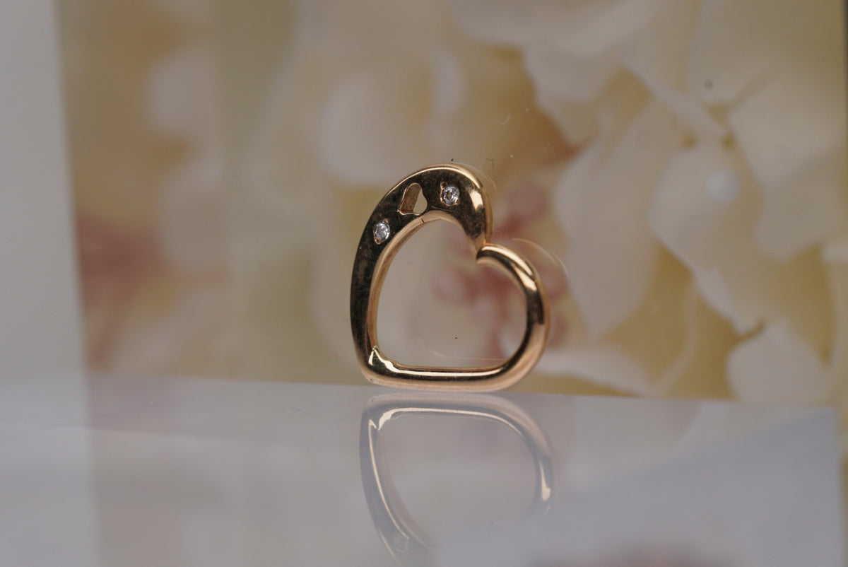 Photo of 14k Gold "Aimee" Heart Shaped Seamless Daith Ring, angled view