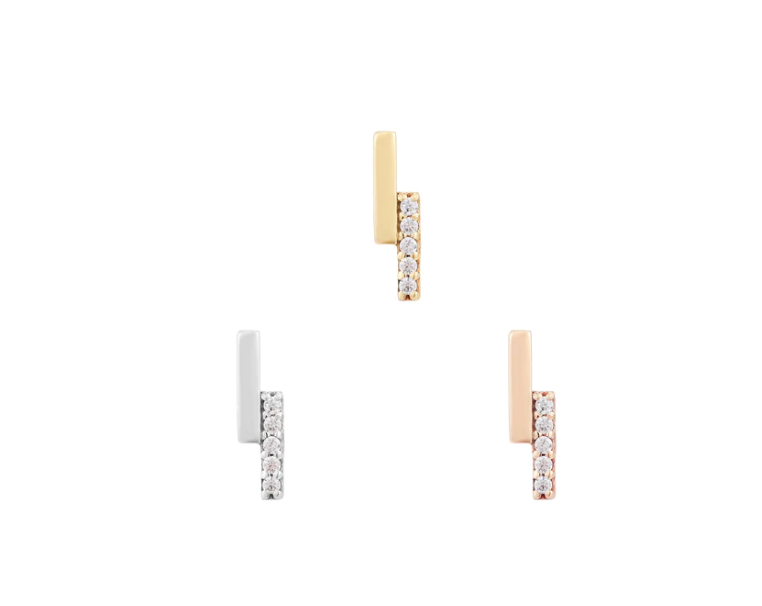 Stock image of Buddha Jewelry’s “Encore” in 14k yellow, white, and rose gold, featuring minimal gold bars alongside sparkling crystal rows.